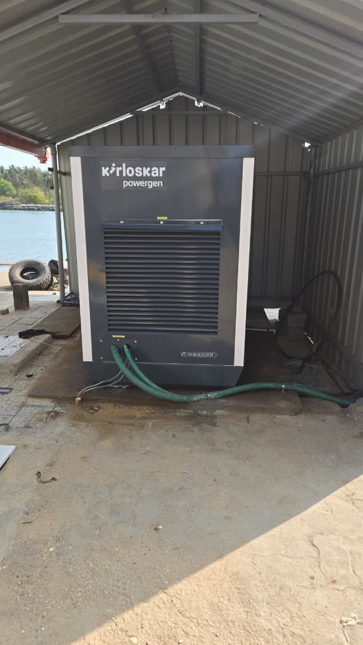 Kirloskar Powergen diesel generator installed in an equipment shed